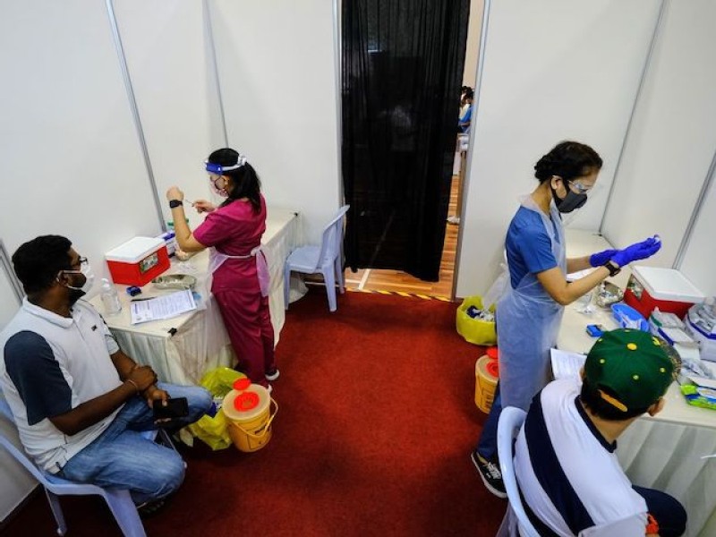 Slow vaccines for seafarers threaten to worsen shipping chaos