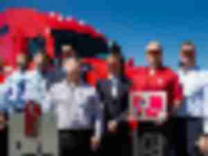 https://www.ajot.com/images/uploads/article/Dignitaries-with-15000th-KW-truck-for-CFI.jpg