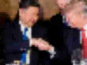 https://www.ajot.com/images/uploads/article/Donald-Trump-Xi-Jinping-handshake-Florida.jpeg
