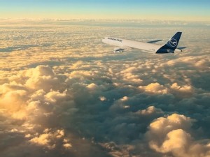 https://www.ajot.com/images/uploads/article/Lufthansa_plane_above_clouds.jpg