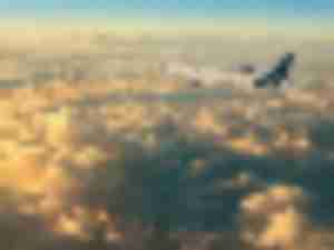 https://www.ajot.com/images/uploads/article/Lufthansa_plane_above_clouds.jpg