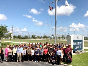 https://www.ajot.com/images/uploads/article/Port-Canaveral-staff-gather-to-for-flag-raising.jpg
