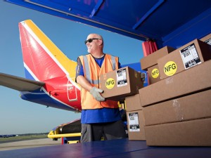 https://www.ajot.com/images/uploads/article/Southwest-Cargo-Handler-unloading.jpg