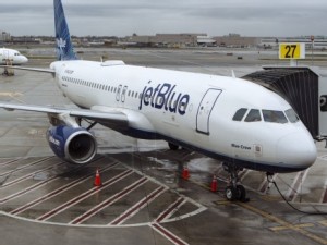 https://www.ajot.com/images/uploads/article/a-jetblue-airways-corp-aircraft-sits-at-a-gate-in-terminal-5-at-john-f-kennedy-international-airport-jfk-in-new-york.jpg