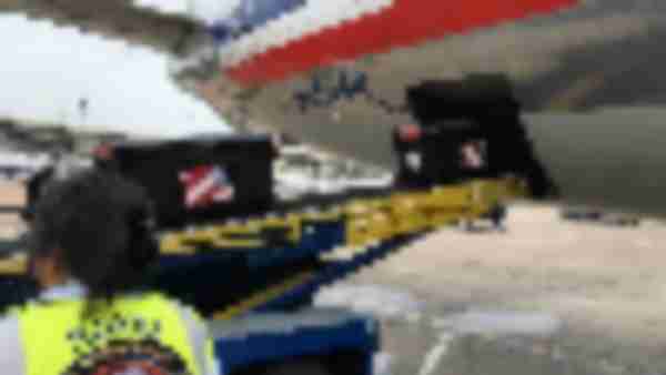 https://www.ajot.com/images/uploads/article/american-airlines-cargo-us-flags-unloading.jpg
