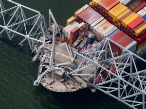 Six presumed dead after bridge collapse, as port disruptions hit cars to coal