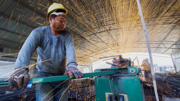 https://www.ajot.com/images/uploads/article/china-laborer-cutting-steel.jpg
