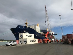 https://www.ajot.com/images/uploads/article/crowley-ship-containers-on-dock.jpg