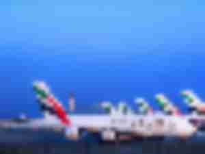 https://www.ajot.com/images/uploads/article/emirates-planes-at-terminals.jpg