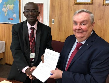 GAC Group Vice President – Americas Bob Bandos, right, signs a Memorandum of Understanding to work cooperatively and finalize an agreement with Guyana National Shipping Corporation Ltd. (GNSC) to provide local expertise. GNSC is led by Managing Director Andrew Astwood, left.