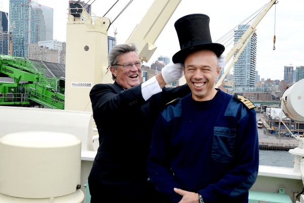 PortsToronto Harbour Master Angus Armstrong “crowns” M/V Tundra Captain Volodymyr Ovdiyenko with the centuries-old silk and beaver top hat at the 154th annual Beaver Hat Ceremony at Redpath Refinery. (CNW Group/PortsToronto)