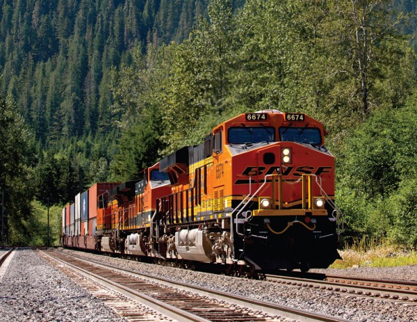 BNSF intermodal container train travels through the mountains in Washington state.