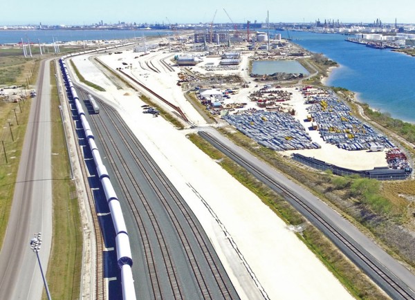At Port Corpus Christi, a train carrying wind turbine components fills the main track parallel to ladder tracks at the first phase of the Nueces River Rail Yard