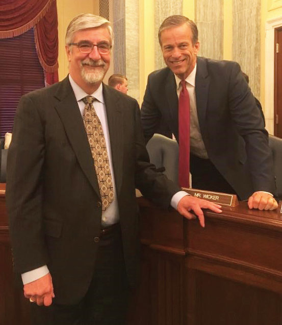 After testifying before a Senate subcommittee on behalf of the Agriculture Transportation Coalition, Perry Bourne, Tyson Food’s director of international transportation and rail operations, left, poses with Senator John Thune, R-S.D., chairman of the Senate Commerce Committee.