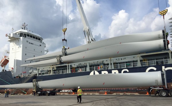 A shipment of wind turbine blades from China is offloaded at Delaware’s Port of Wilmington, which is enjoying an uptick in project and military cargo activity. 