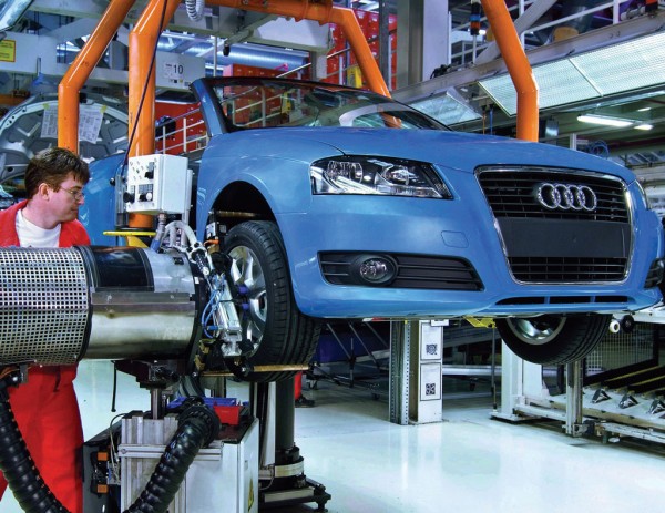 Auto worker on an assembly line at an Audi factory in Mexico