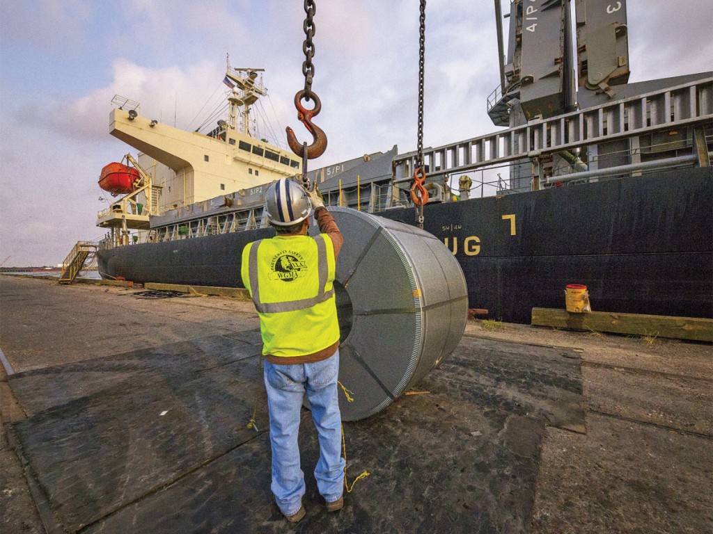 Stevedore unloads steel rolls at the Port of Brownsville.