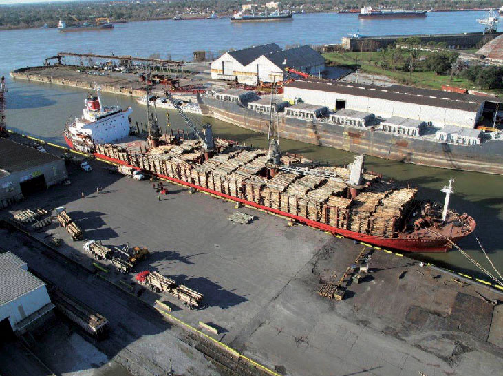 A log ship being loaded at the new facility at St. Bernard Port. 