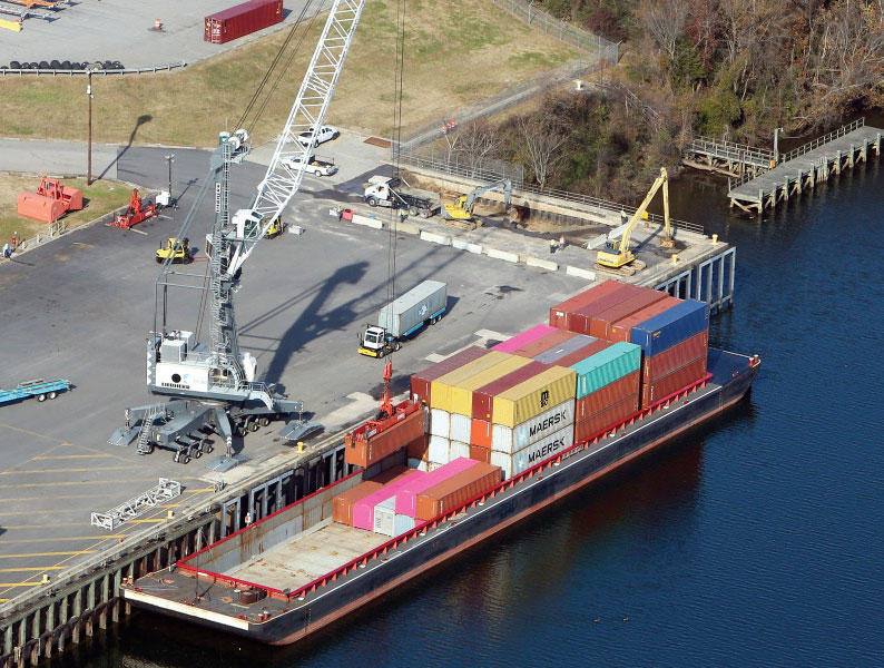 A container barge is worked at The Port of Virginia’s inland Richmond Marine Terminal, where soybean exports are driving burgeoning volumes.