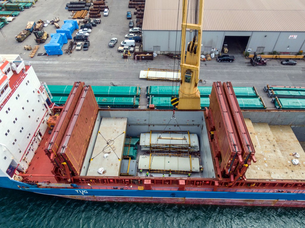Components for building a $1 billion power plant in Niles, Michigan, are offloaded from one of six vessels bringing the oversize units to Port of Indiana-Burns Harbor this summer.
