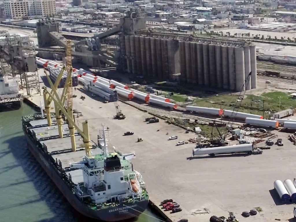 Port of Galveston activity includes rail and truck transport of wind energy components and unloading of a shipload of grain.