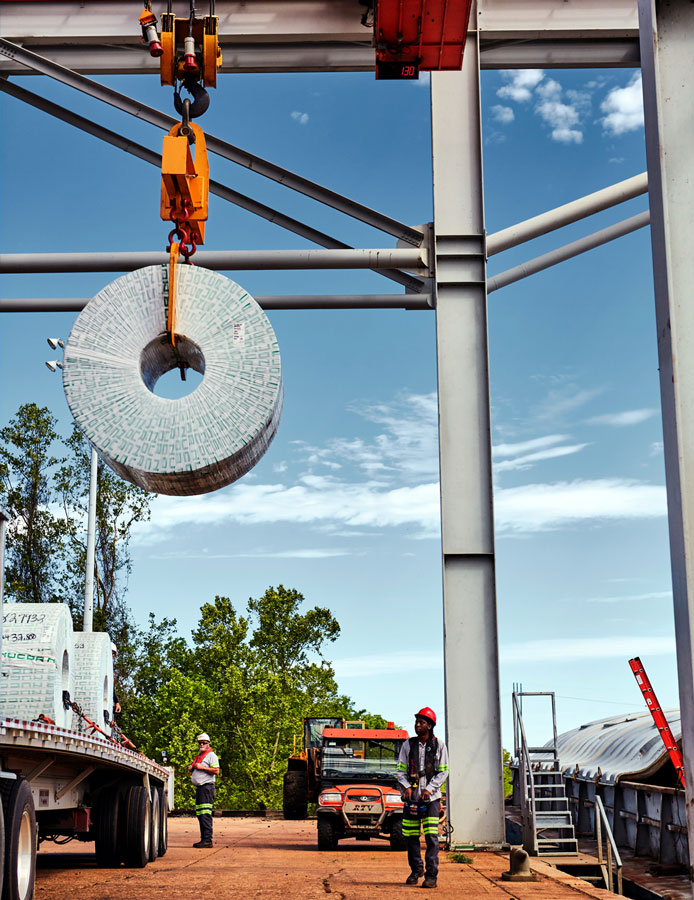A steel coil is loaded onto a truck at the Port of Caddo-Bossier, which sees e-commerce driving record steel volumes.