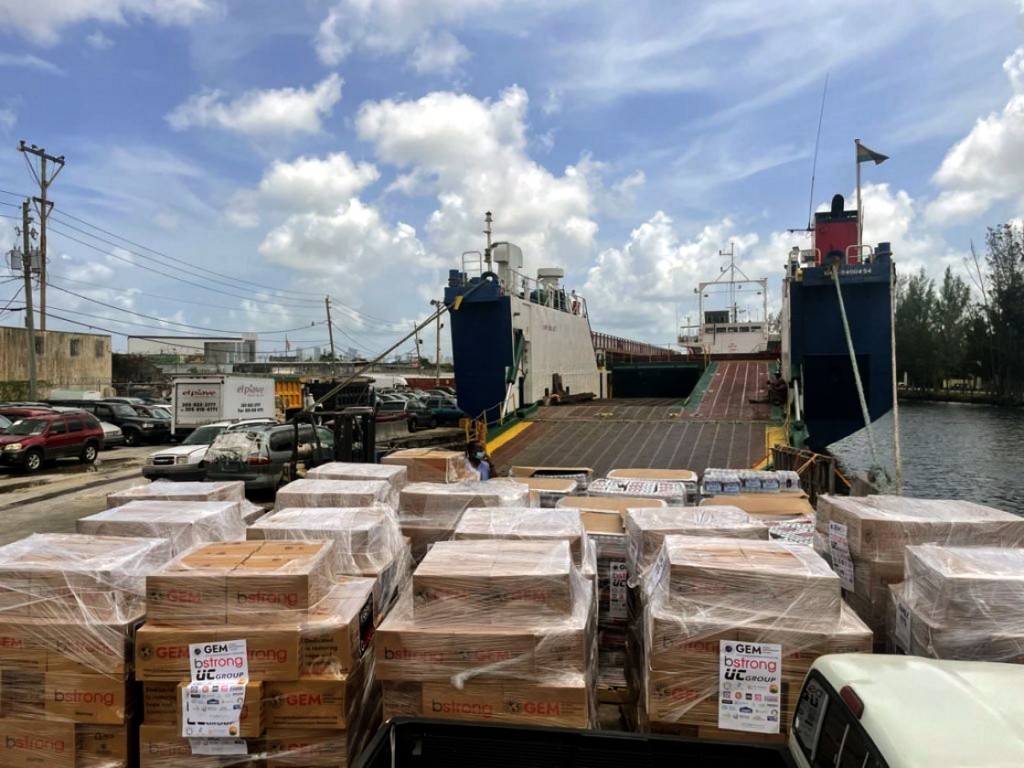 Following a devastating September earthquake in Haiti, relief supplies are loaded on a Seacoast Shipping vessel on the Miami River.