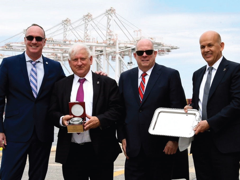 Celebrating the May inaugural call at the Port of Baltimore by ZIM Integrated Shipping Services Ltd.’s ZIM E-Commerce Baltimore Express service from China and Southeast Asia are, from left: William P. Doyle, executive director, Maryland Port Administration; Yair Seroussi, chairman, ZIM; Maryland Gov. Larry Hogan; and Eli Glickman, president and chief executive officer, ZIM. 