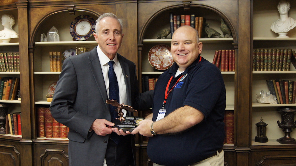 ABF Freight President Tim Thorne, left, accepts the Pro Patria Award from Jon Woodham, Northwest Arkansas Area chairperson for Employer Support of the Guard and Reserve.