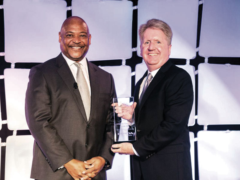 American Honda Administration Department Head and Senior Manager Charles Harmon presents Philip W. Byrne, Vice-President of Sales, North America for Atlantic Container Line (ACL) with Honda’s annual Premier Partner Award