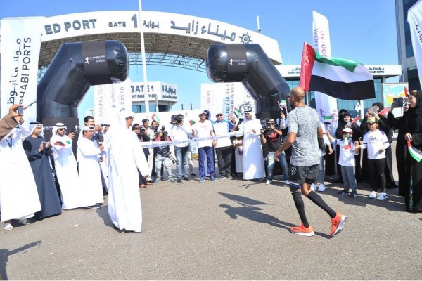 Abu Dhabi Ports cheer on Dr. Khaled Al Suwaidi as he approaches the finish line at Zayed Port