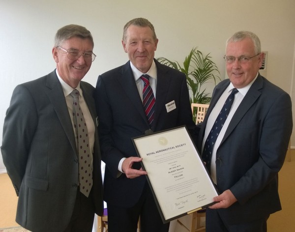 RAeS Chief Executive, Simon Luxmoore (right) presents Alexey Isaikin (centre) with his Fellowship certificate, joined by Brian Phillipson, MD Engineering Solutions at Marshall, who is also a Fellow of the RAeS.