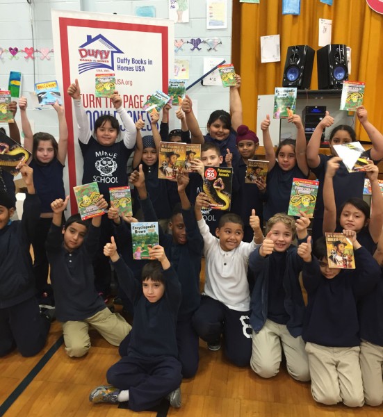 Children at the Private Nicholas Minue School in Carteret, New Jersey are delighted to receive books from Duffy Books in Homes USA.