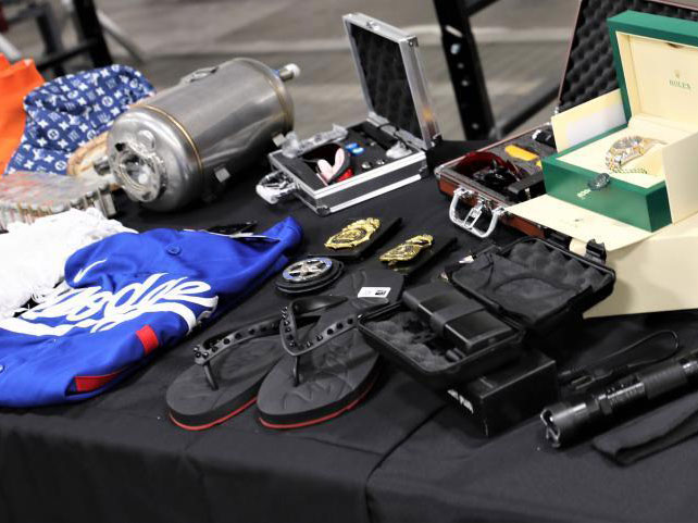 Seized counterfeit goods at LAX On display were recently seized fraudulent goods, including counterfeit wearing apparel, fake police badges, fake Rolex watches and a dangerous unapproved taser gun concealed in a flashlight.