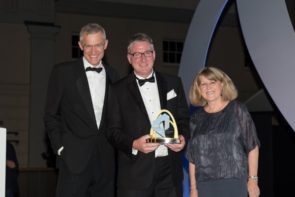 Simon Mullet, Company Secretary of Port of Felixstowe, collects the Port Operator of the Year Award from BBC presenter Jeremy Vine (left) and Janet Porter, Editor-in-Chief Lloyds List Containers