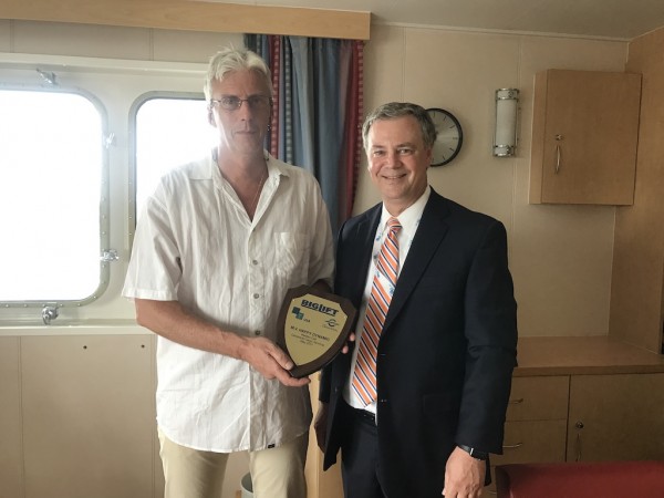 Joe Cruise, commercial manager of GT USA, presents a commemorative plaque to Captain J.J.J. de Boer of the M.V. Happy Dynamic to commemorate the vessel’s maiden call to Canaveral Cargo Terminal.