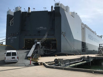 Work crew drives up ramp of Höegh Trotter prior to discharging vehicles (Photo: Canaveral Port Authority)