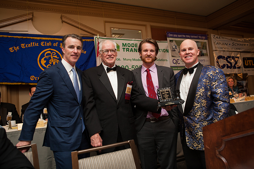 From left to right: Thomas Holt, Jr; James Fleming, President of the Traffic Club of Philadelphia; Thomas Holt, III; and Leo A. Holt.