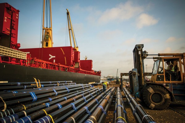 Steel pipes being unloaded from a breakbulk carrier at the Port of Houston, TX