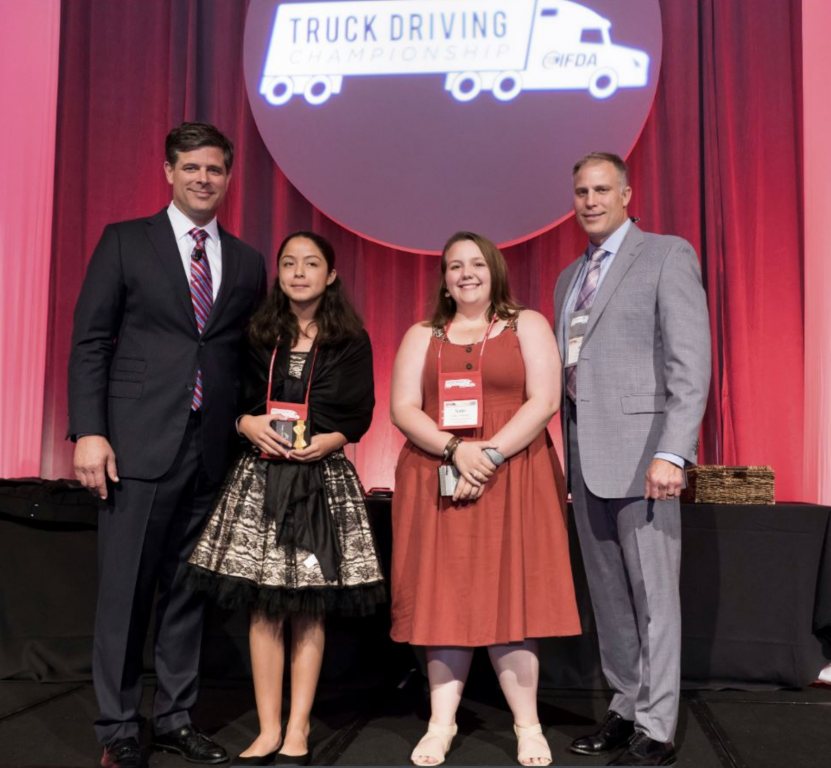 Pictured from left to right: Mark Allen, President of IFDA, Jocelyn Tabares, Sadie Wadman representing Reinheart, and Al Barner of Fleet Advantage. Third winner not pictured – Katy Brown representing Shamrock Foods.