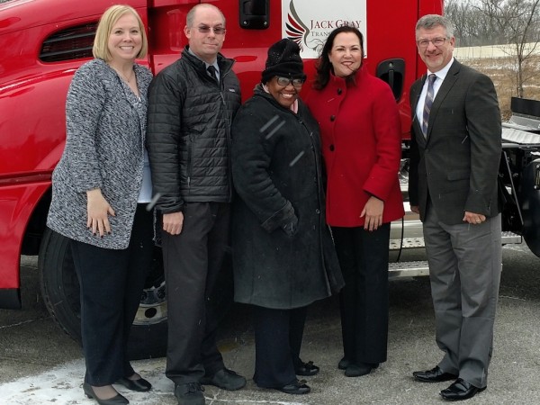 South Shore Clean Cities’ Communications Director Lauri Keagle (l) , Indiana Department of Environmental Management Senior Environmental Manager Shawn Seals, Gary Mayor Karen Freeman-Wilson, Jack Gray Transport, Inc. owner Danette Garza and Jack Gray Transport, Inc. Chief Operating Officer James Dillman stand in front of one of six new clean diesel drayage trucks at the Gary company Monday morning. The trucks were made possible in part by an IDEM DieselWise Indiana grant in cooperation with South Shore Clean Cities.