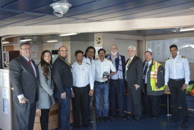 PhilaPort presents master of M/V Shuba B with replica Liberty Bell. From left to right: Joseph Fox, PhilaPort; Christina Lista, Chilean American Chamber of Commerce; Byron Montalvo, Holt Logistics Corp; Shuba B Chief Mate, Chief Engineer, and Captain Binay K. Singh; J. Ward Guilday, Pilots’ Association for the Bay & River Delaware; Sean Mahoney, PhilaPort; Dan Lazovich, MSC and Shuba B Second Mate.
