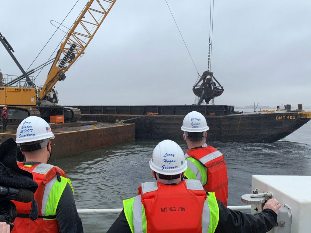 (left to right: MD Secretary of Transportation Gregory Slater, MD Governor Larry Hogan, and MPA-Port of Baltimore Executive Director William Doyle observe dredging operations at Seagirt Marine Terminal for a new 50-ft. berth in March 2021.