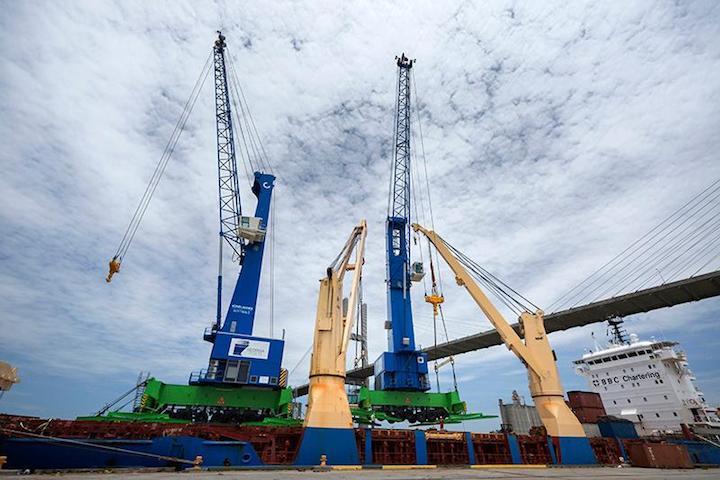 The first of two mobile harbor cranes is offloaded at the Port of Savannah's Ocean Terminal, June 30, 2020. 