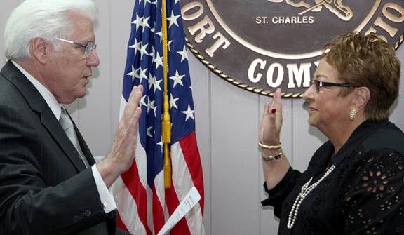 Judy B. Songy of St. John the Baptist Parish being sworn-in to the Board of Commissioners by Executive Director Paul G. Aucoin