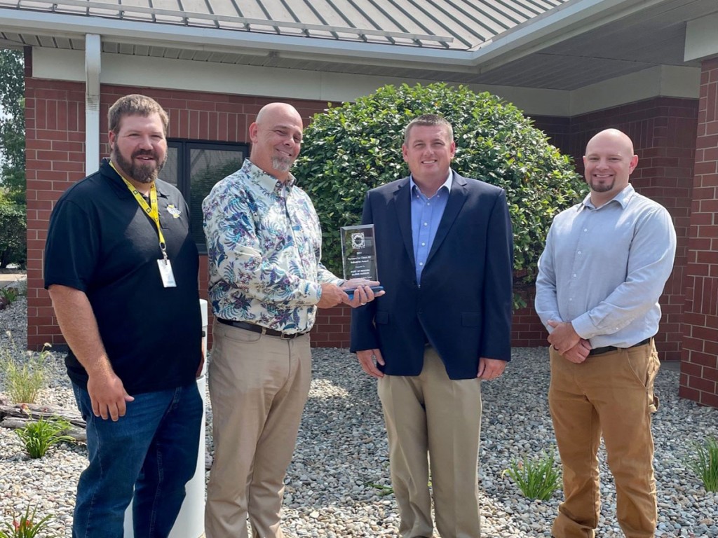 Charles Breitenfeldt, Partners for Clean Air and Scott Nelson, board member for Partners for Clean Air present Ports of Indiana Ryan McCoy, Burns Harbor port director and Nick Harper, operations manager, with the Industrial Award.