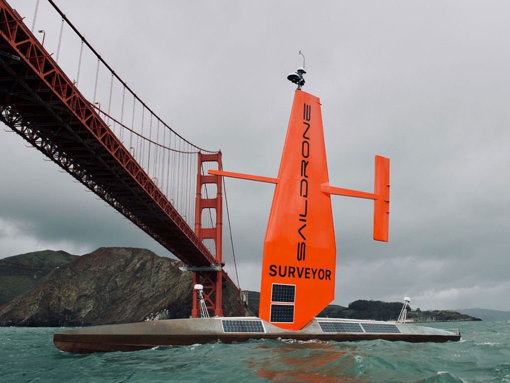Saildrone Surveyor sailing under the Golden Gate Bridge toward Pacific Ocean