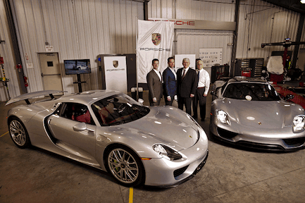 Porsche Production Manager David Burkhalter, Porsche Manager of Vehicle Logistics and Port Operations Justin Newell, Georgia Ports Authority Global Manager Bill Jakubsen, and GPA General Manager of Operations Bill Dawson stand near the first shipment of Porsche's hybrid 918 Spyder automobile at the Atlantic Vehicle Processors facility at the Port of Brunswick, Thursday, March 6, 2014. The carmaker plans to produce up to 918 of this special model at its plant in Stuttgart, Germany. The GPA will handle East Coast imports of the supercar. (GPA Photo/Stephen B. Morton)