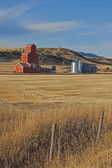 https://www.ajot.com/images/uploads/article/a-grain-elevator-and-silos-stand-amid-fallow-wheat-fields-in-the-gallatin-valley-north-of-bozeman_u-l-pyy6750.jpg
