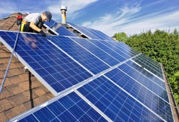 https://www.ajot.com/images/uploads/article/solar-panels-being-installed-on-a-residential-roof.jpg